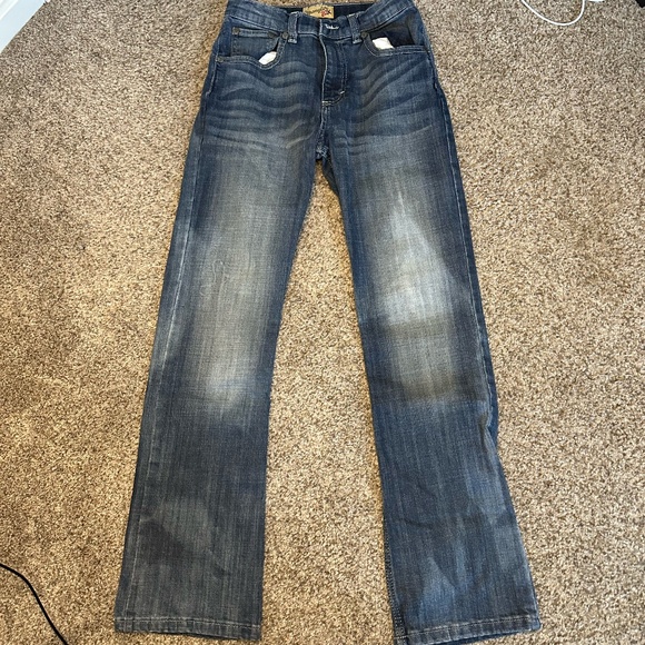 Wrangler Other - Blue denim Wrangler jeans with a distressed wash